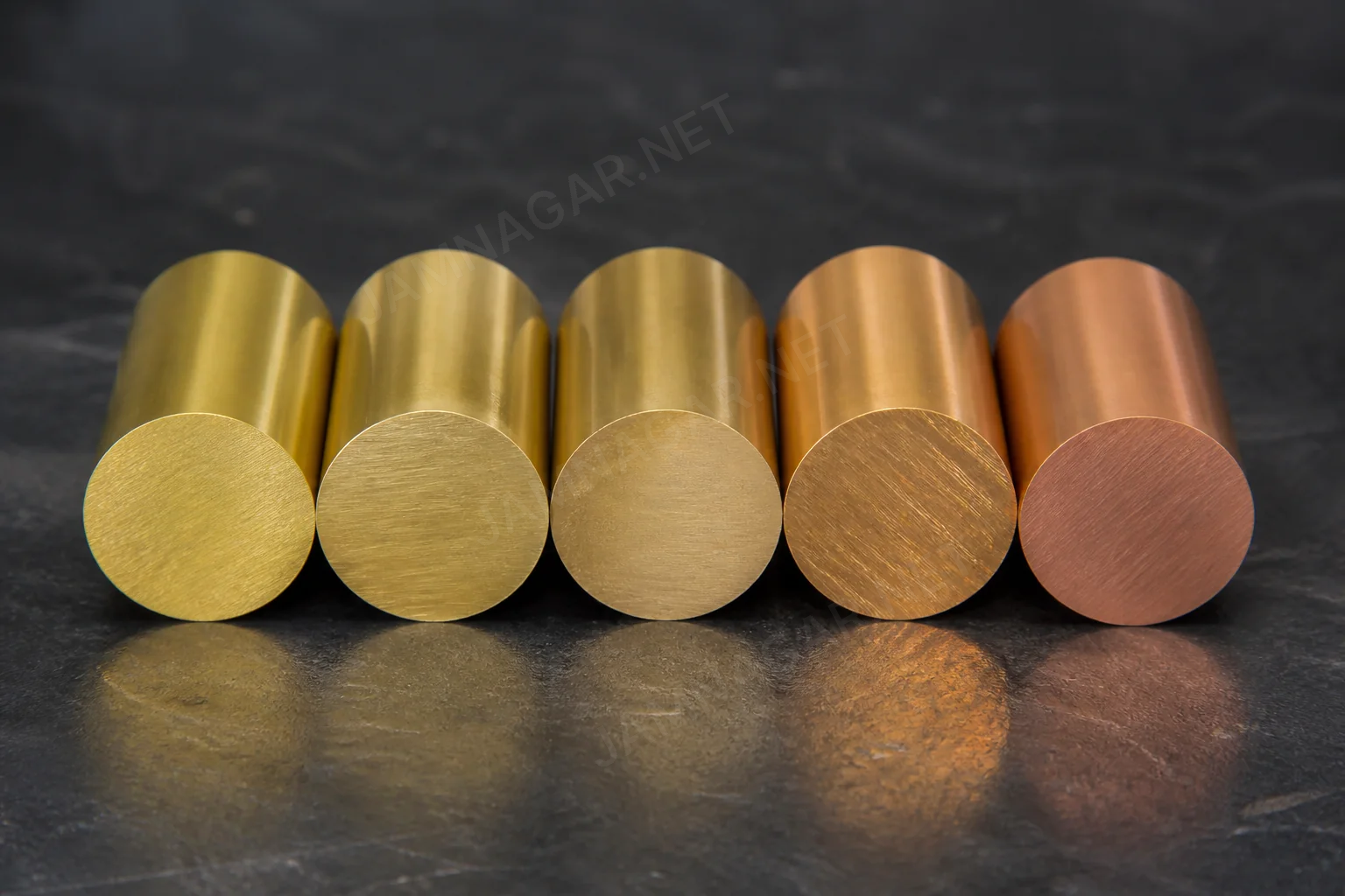 Brass rods and machined components representing common alloy grades